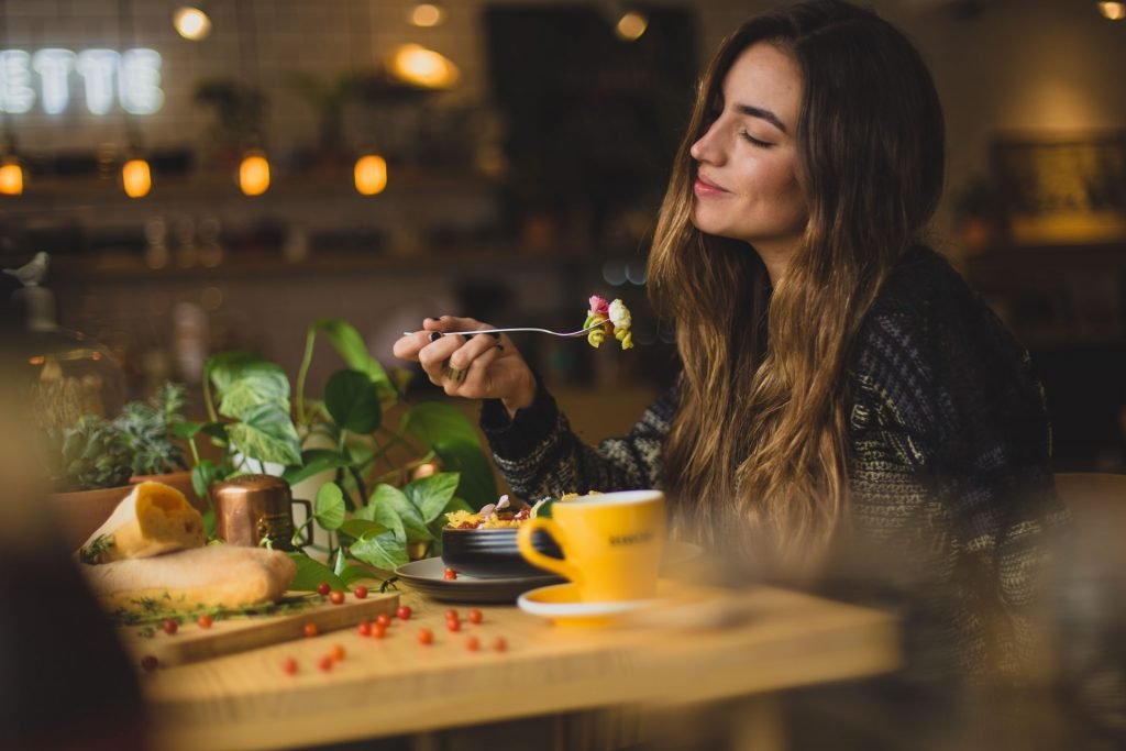 woman eating in a cafe