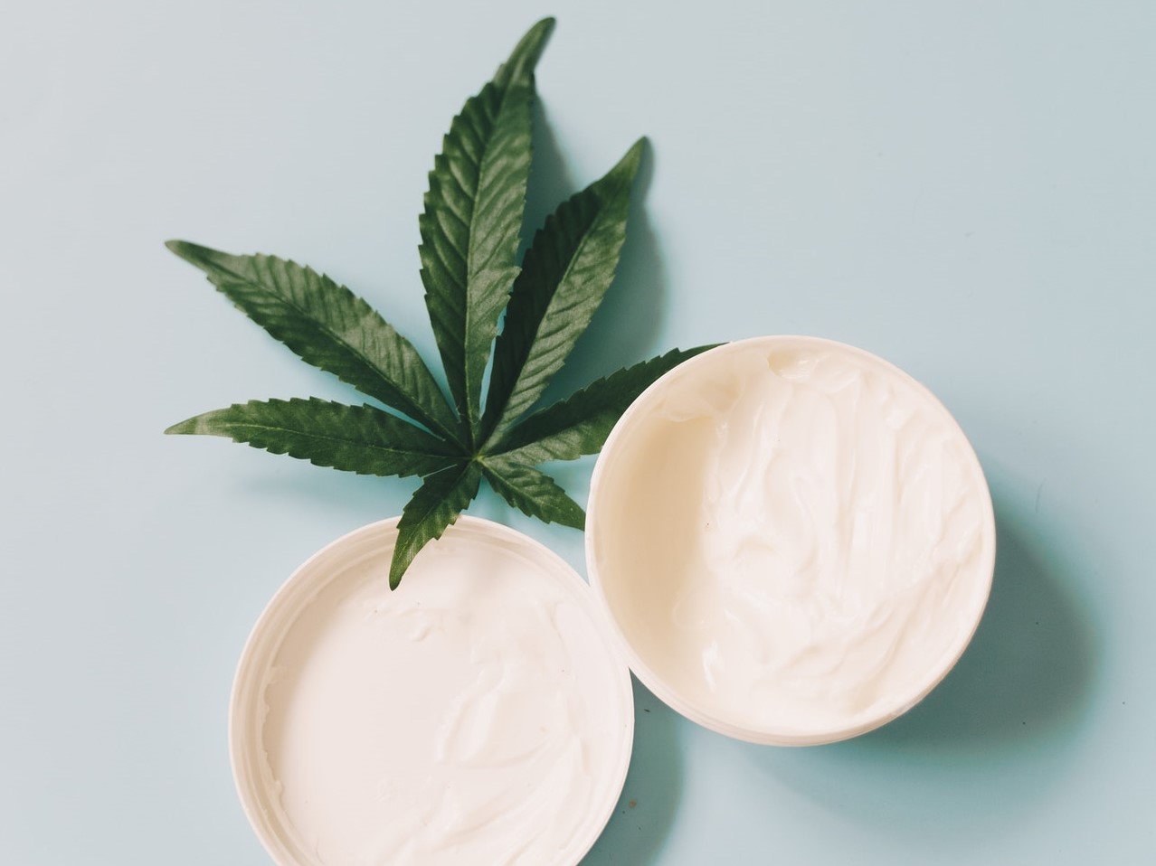 body cream with cannabis leaf