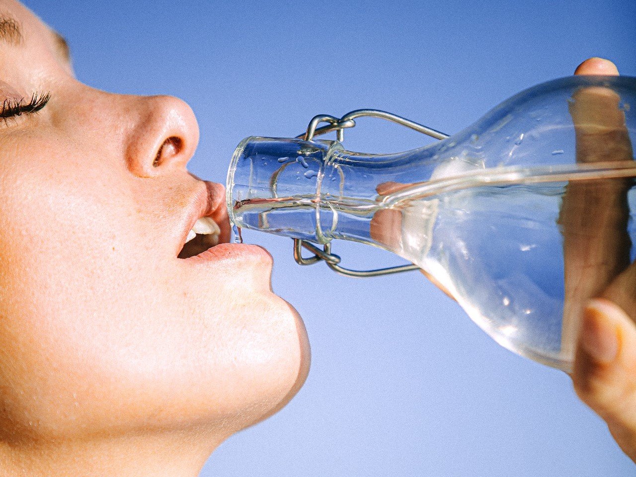 close up of girl drinking water